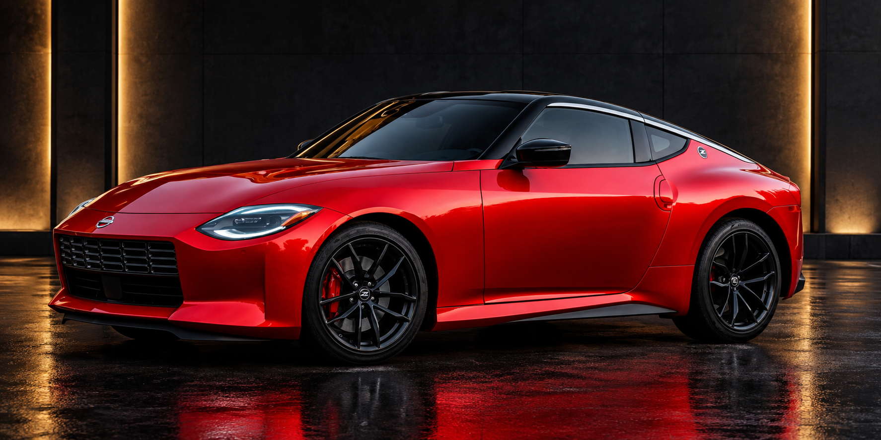 Red sports car detailed under warm lighting at the ER2 Auto Service shop in Marlborough, MA